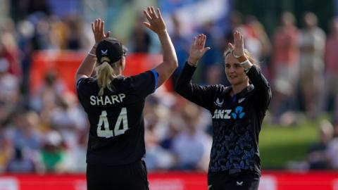New Zealand's Melie Kerr (left) celebrates bowling out England's Alice Capsey (not pictured) during the Vitality IT20 match at The Spitfire Ground, Canterbury