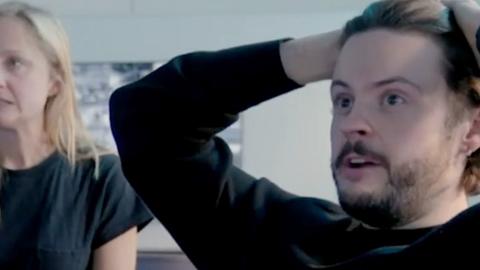 A man with his hands on his head, he's anxious