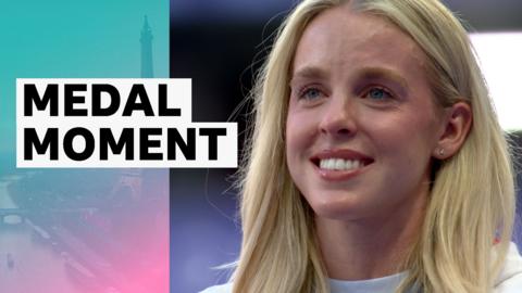 Watch as team GB's Keely Hodgkinson is awarded her gold medal for the women's 800m.