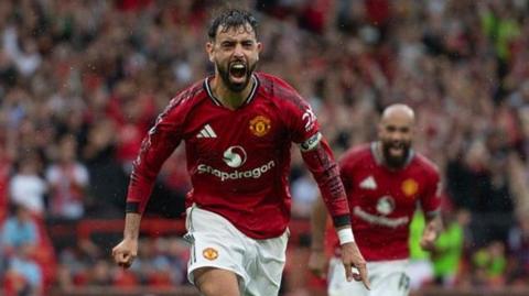 Manchester United captain Bruno Fernandes celebrates scoring his winning penalty against Burnley