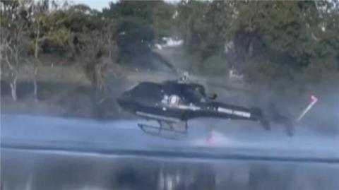 Helicopter near a lake