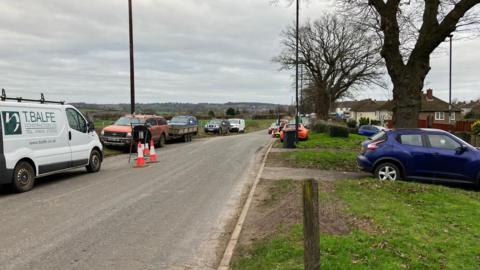 Radbourne Lane with cars parked on both sides