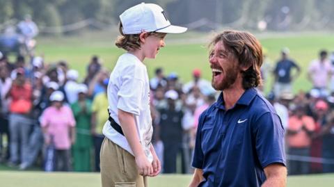 Tommy Fleetwood's son Frankie runs on to the 18th green to celebrate with him in Delhi