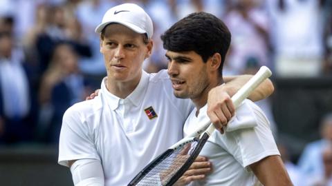 Jannik Sinner and Carlos Alcaraz hug after the Wimbledon final