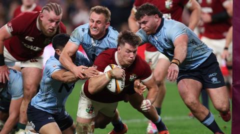 Huw Jones goes over for a try