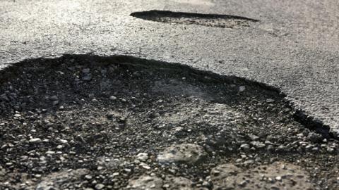 Large pothole in road