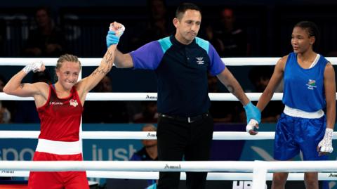 Ruby White is confirmed as the seventh England boxer with reach the Commonwealth Games finals in Glasgow following her second-round stoppage of Namibia's Mischa Araes