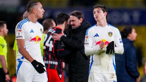 Mateo Joseph and Brenden Aaronson talking to each other on the pitch following Leeds' match against Blackburn