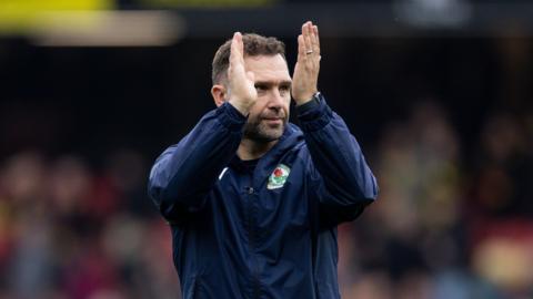 Blackburn manager John Eustace applauds the fans after his side lost 1-0 to Watford