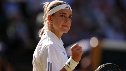 Karolina Muchova celebrates with a clenched fist