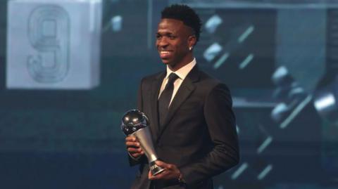 Vinicius Jr holds the Fifa Best men's player of the year trophy