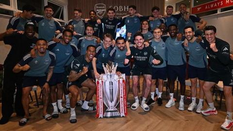 Arsenal celebrate winning the title