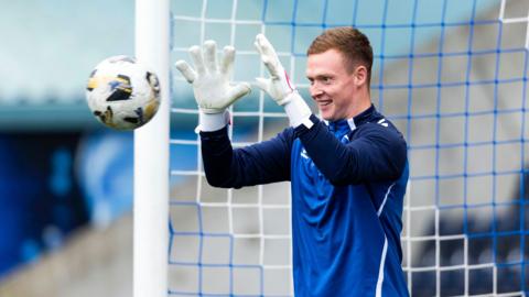 Kieran Wright catches a ball in a warm-up