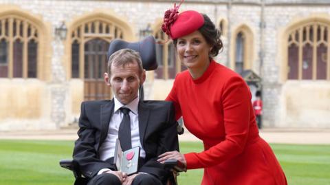 Robert Burrow with his wife Lindsey after he was made an MBE by the Princess Royal during an investiture ceremony at Windsor Castle on April 5, 2022 in Windsor, England. 