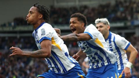 Joao Pedro of Brighton & Hove Albion celebrates scoring his team's second goal with teammates Julio Enciso during the Premier League match between Brighton & Hove Albion FC and Manchester United FC at Amex Stadium