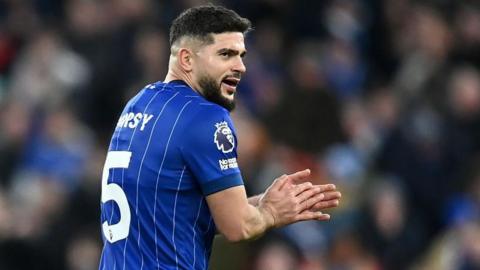 Sam Morsy claps the home fans