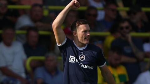 Millwall goalscorer Macauley Langstaff raises his fist in celebration