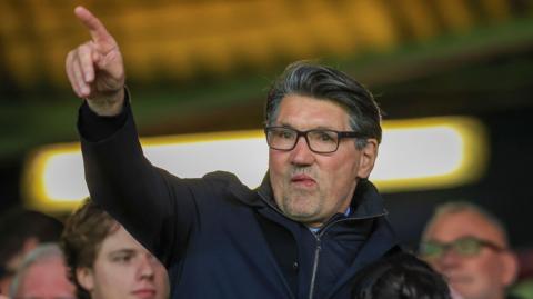 Mick Harford points to the crowd during Luton's Championship fixture against Watford in October