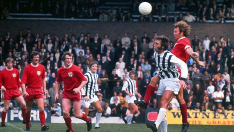 Brian Garvey in a red Colchester change strip outjumps Jeff Astle in a striped West Brom shirt during the Watney Cup Final in 1971