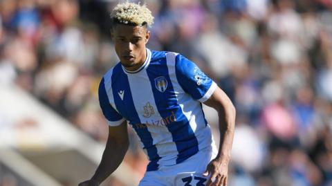 Lyle Taylor in action for Colchester United