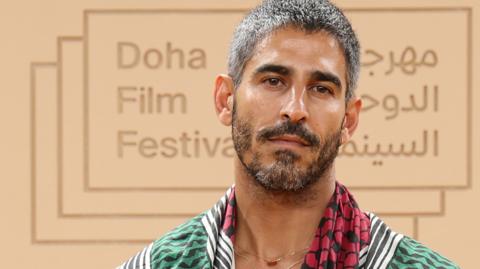File photo showing Ahmed Shihab-Eldin at the Doha Film Festival 2025 in Doha, Qatar (24 November 2025). He has short brown hair and a short brown beard.