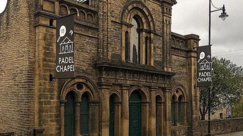 A Victorian chapel building with signs added to the front that read 'Padel Chapel'