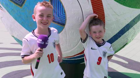 Two boys in England shirts