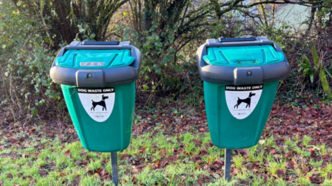 Two dog bins side by side