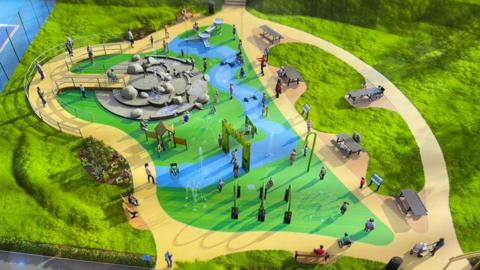 An artist's impression showing an aerial view of a splash pad at a park. There are pathways around the brightly coloured play area, with a central rock feature as well as various fountains and pieces of play equipment.