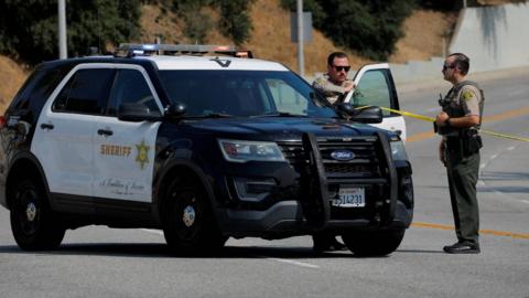 Police officers respond to a scene in Los Angeles