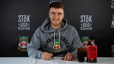 George Thomason signs his Wrexham contract