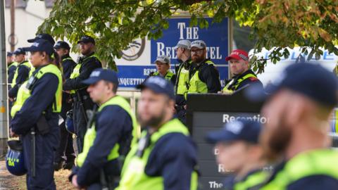 About 13 police officers stood outside The Bell Hotel in Epping during a protest.