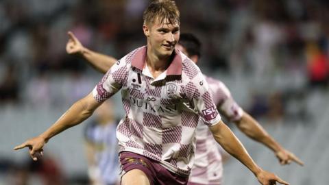 Thomas Waddingham celebrates scoring for Brisbane Roar