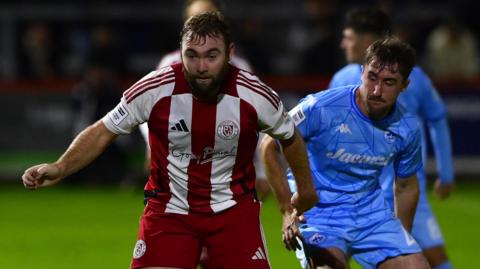 Connor Hall playing against Truro City