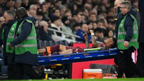 Savinho goes off on a stretcher for Manchester City against Tottenham in the League Cup