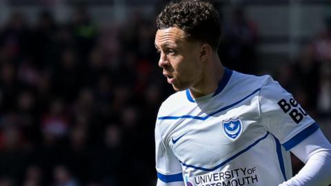 Jordan Williams playing in a white Portsmouth shirt