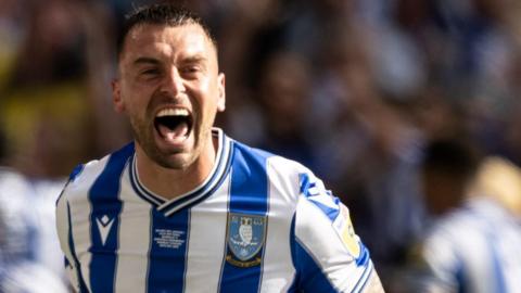 Jack Hunt celebrating while wearing a Sheffield Wednesday shirt