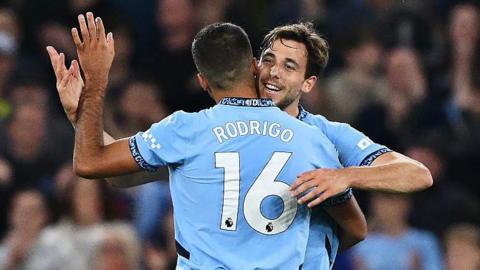 Nico Gonzalez and Rodri celebrate