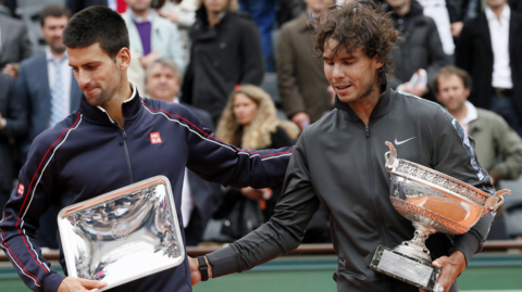 Novak Djokovic and Rafael Nadal (hold their trophies during their Men's Singles final tennis match of the French Open 