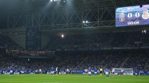 Oviedo and Espanyol players protest at the start of their La Liga match