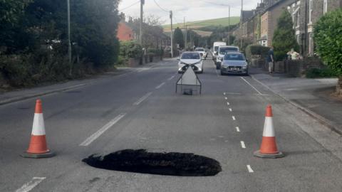 Sinkhole in Hayfield Road, New Mills, Derbyshire