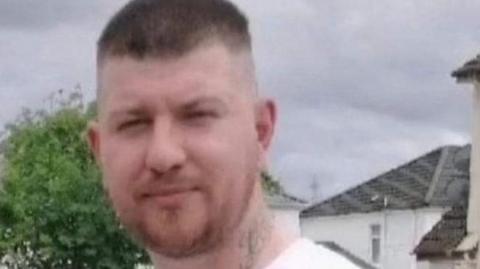 Ross Hanratty looking straight at the camera.