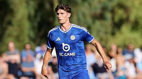 Ben Nelson runs on the pitch with his arms at his side during a pre-season friendly for Leicester
