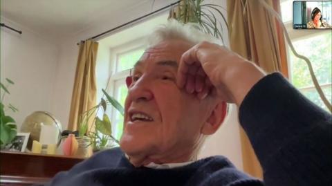 Larry Lamb in his living room.