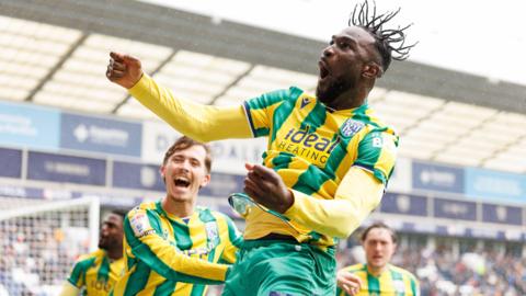 Daryl Dike of West Bromwich Albion scores a goal and celebrates