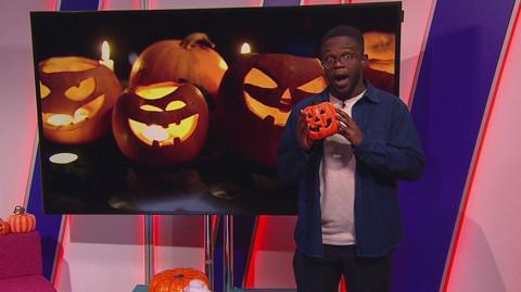 De-Graft in a studio full of pumpkins