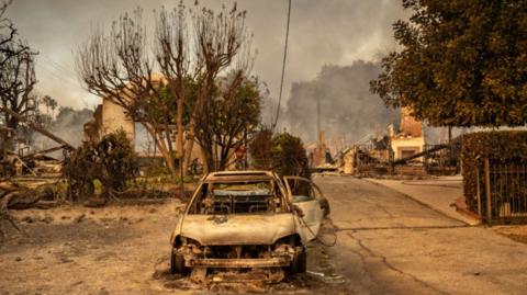 A burned out car in Altadena, California during the Eaton fire