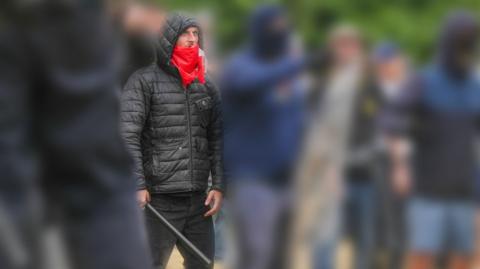 Thomas Birley holding a bat during Rotherham unrest