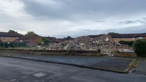 A huge pile of rubble where the former Hourglass pub has been demolished