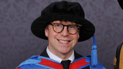 Josh Widdicombe with Exeter University chancellor Sir Michael Barber